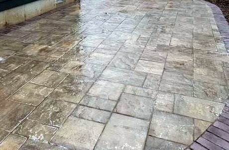 Natural stone paver patio looks beautiful when wet.